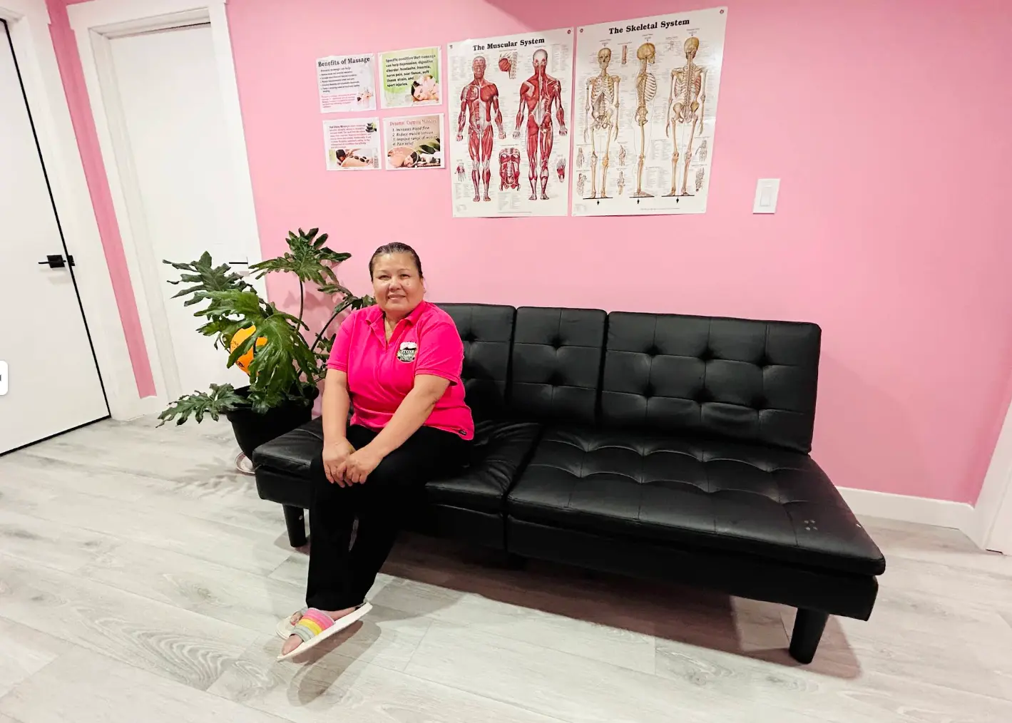 Stone Massage reception area with seating and anatomy charts